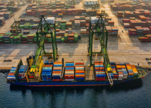 ieepa-tariff-refund-cbp-update-container-port Container ship and cargo terminal representing global trade and import shipments affected by IEEPA tariff refunds and CBP customs processing.